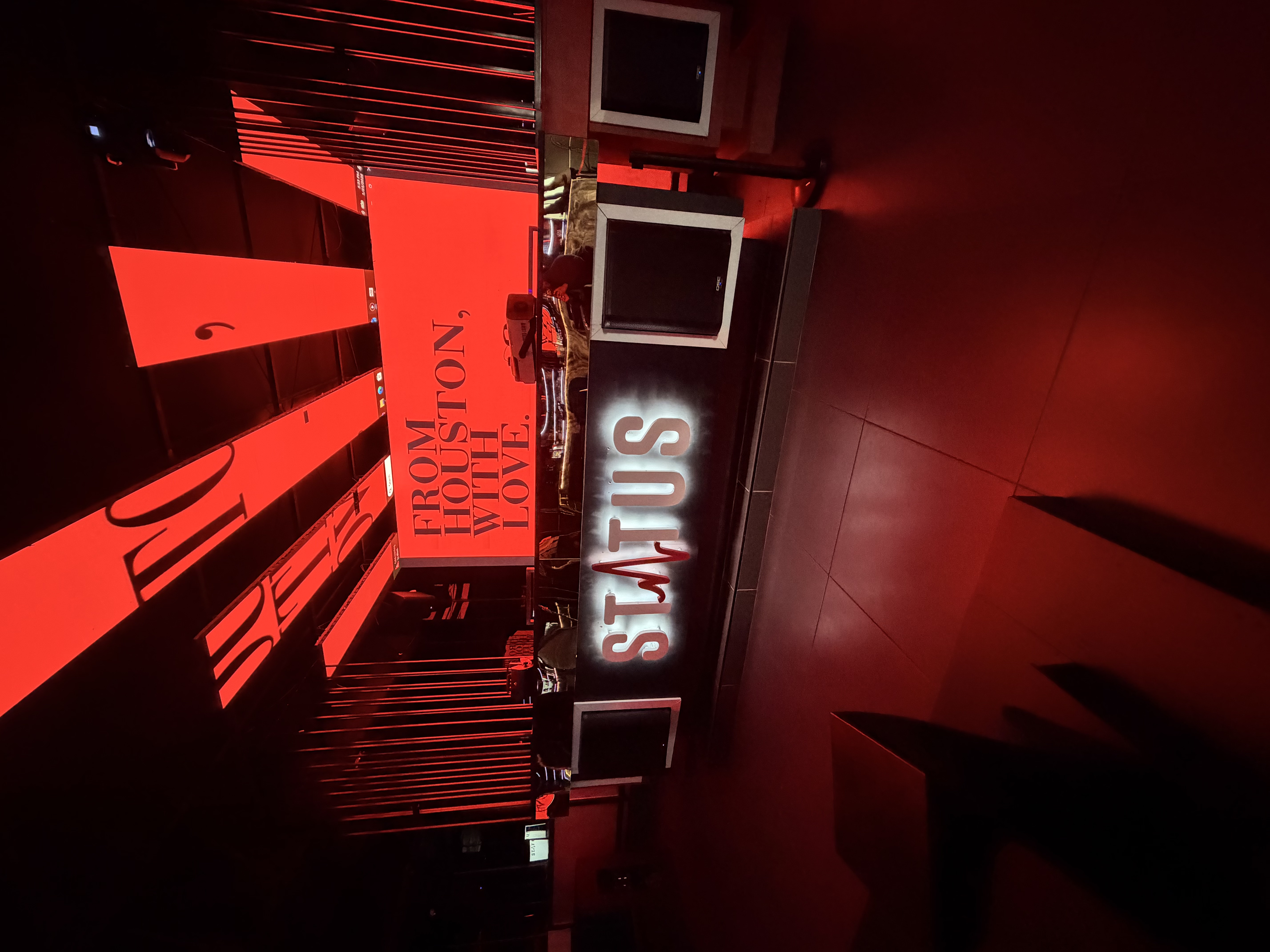 The Status DJ booth beneath the venue’s red light installation
